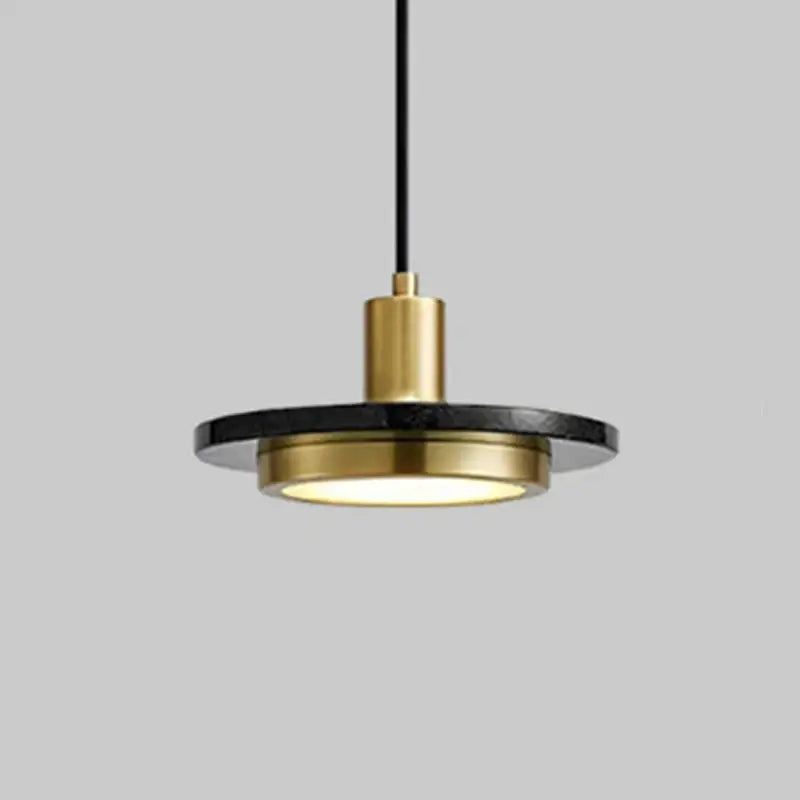 Modern pendant light by DecorBites led marble features a sleek black marble disc with polished brass accents emitting warm glow