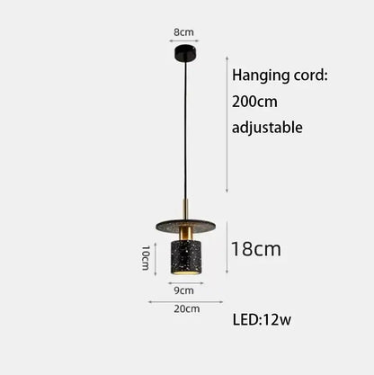 Black speckled cylindrical decorbites led marble pendant light with gold metal accent and adjustable black cord for dining room