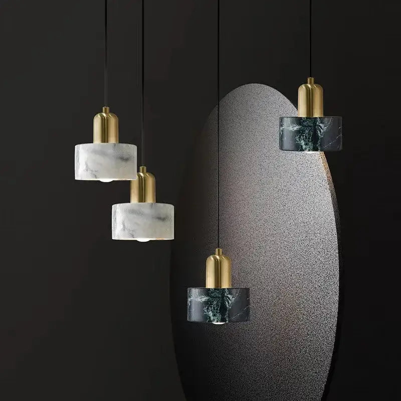 Decorbites led marble pendant light with cylindrical white marble shades and polished brass fixtures for dining room