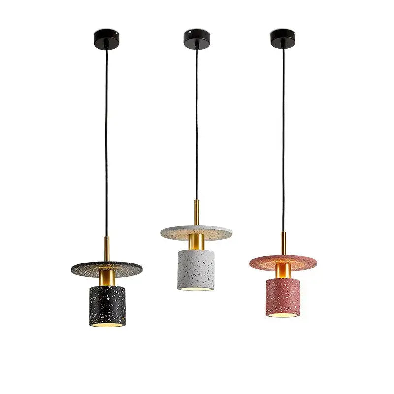 Three DecorBites led marble stone pendant lights with speckled concrete shades and gold-toned frames for dining room use