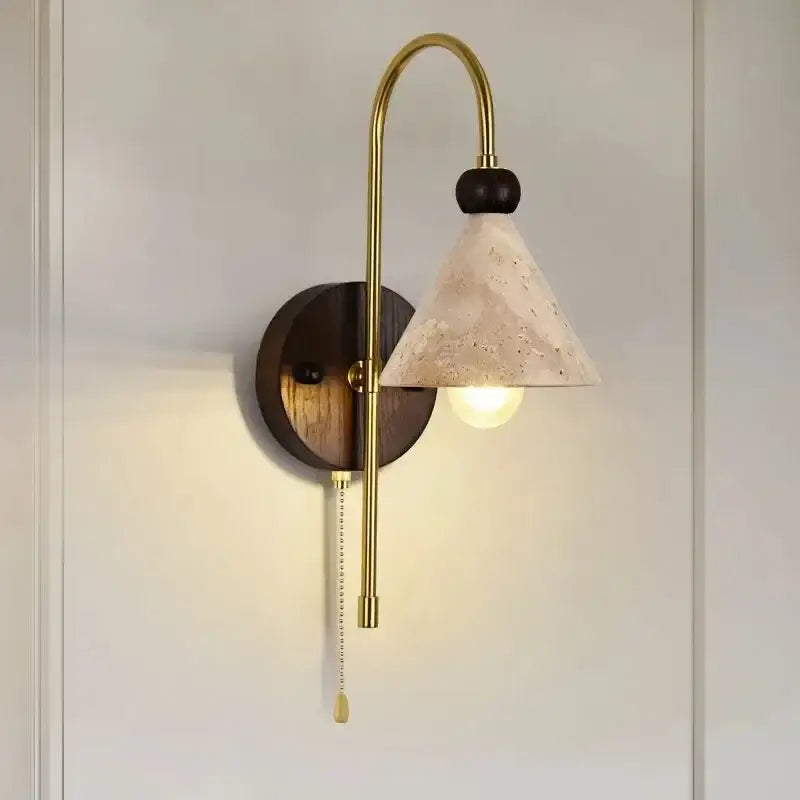 Gold-toned decorbites led marble wall light with textured off-white shade and dark wood backplate for bedroom use