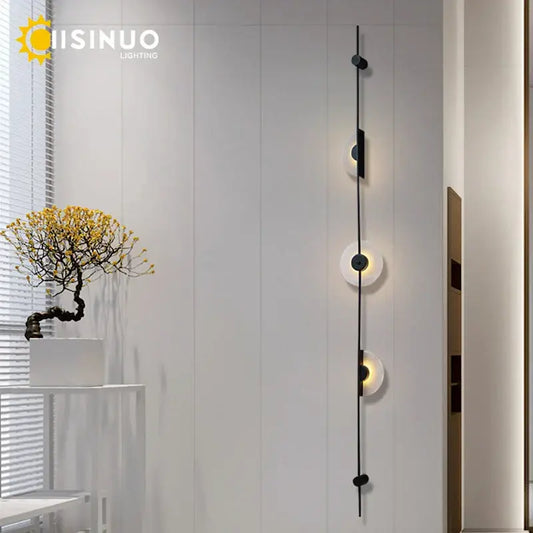 Minimalist black metal DecorBites LED marble wall lights with three frosted glass shades for living room and stairs