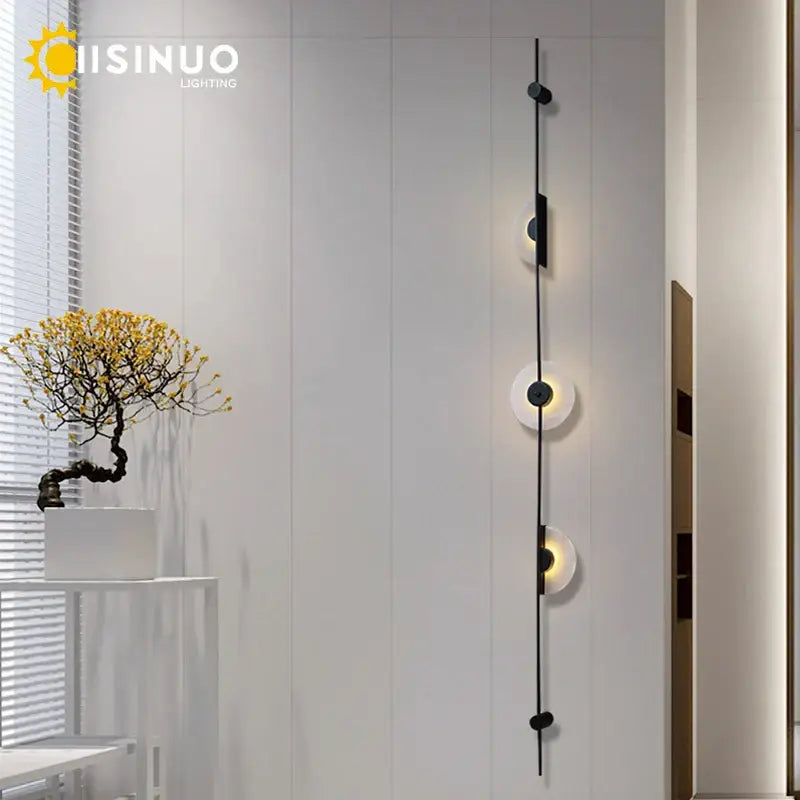 Minimalist black metal DecorBites LED marble wall lights with three frosted glass shades for living room and stairs