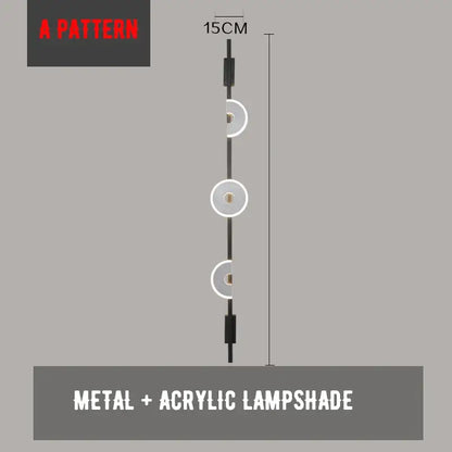 A modern 15cm tall decorbites led marble wall light with black metal frame and three circular acrylic shades for living rooms