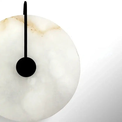 Minimalist white onyx wall clock with sleek black hand and circular base in decorbites led marble wall sconce design