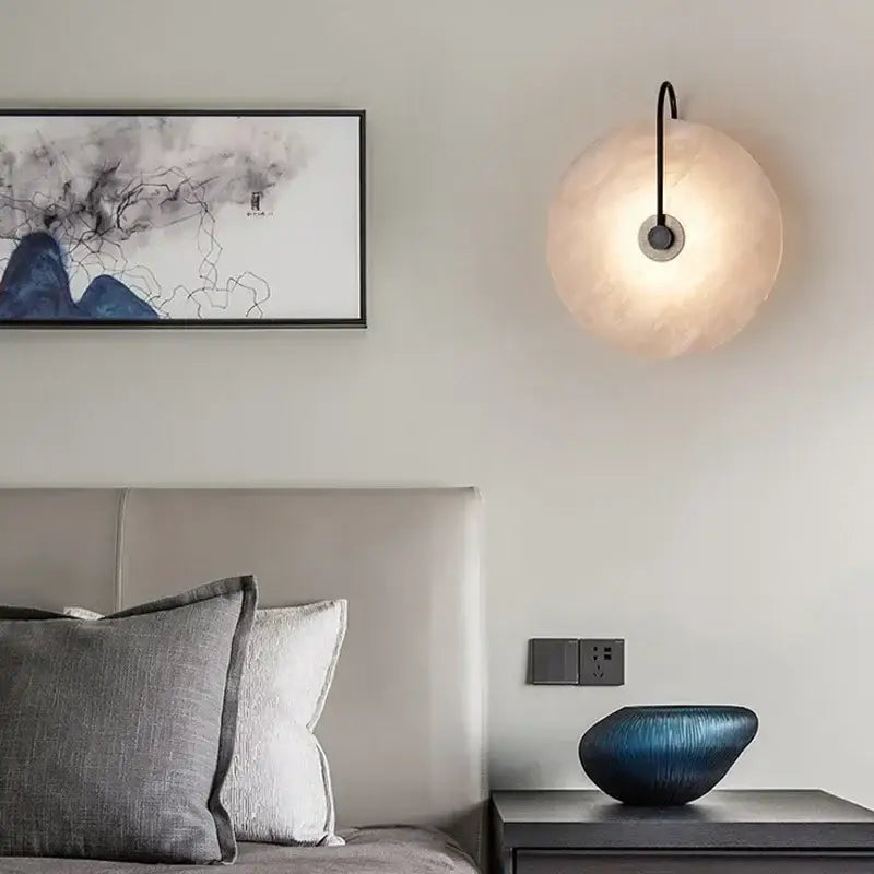 DecorBites LED marble wall sconce with a matte black arm and frosted glass shade for living room bedroom decor