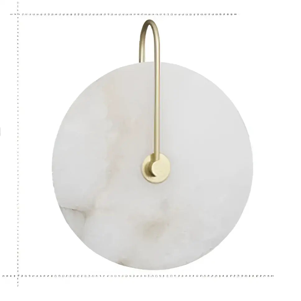 Decorbites led marble wall sconce featuring a circular white marble coaster with gold metal hook and ring for hanging