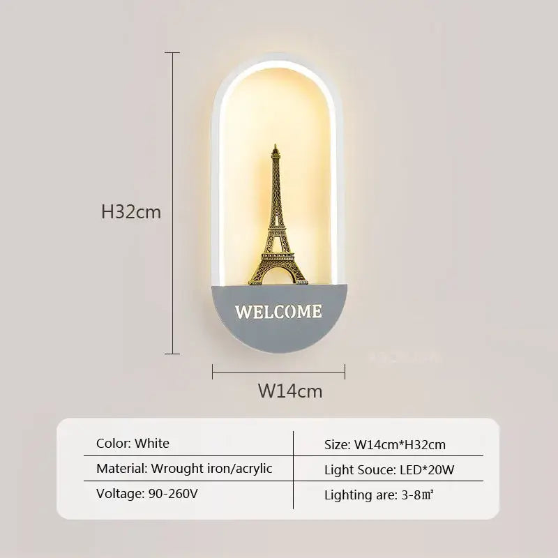 White wall light featuring decorbites led metal acrylic design with golden eiffel tower illuminated in arched housing
