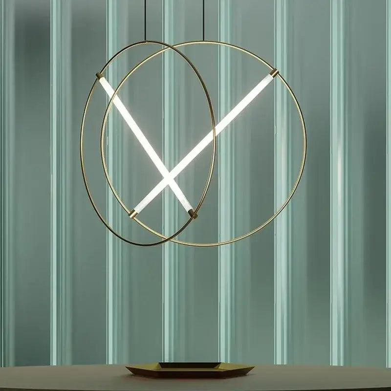 Modern gold-toned DecorBites LED metal pendant light with intersecting LED strips for dining room and bedroom use