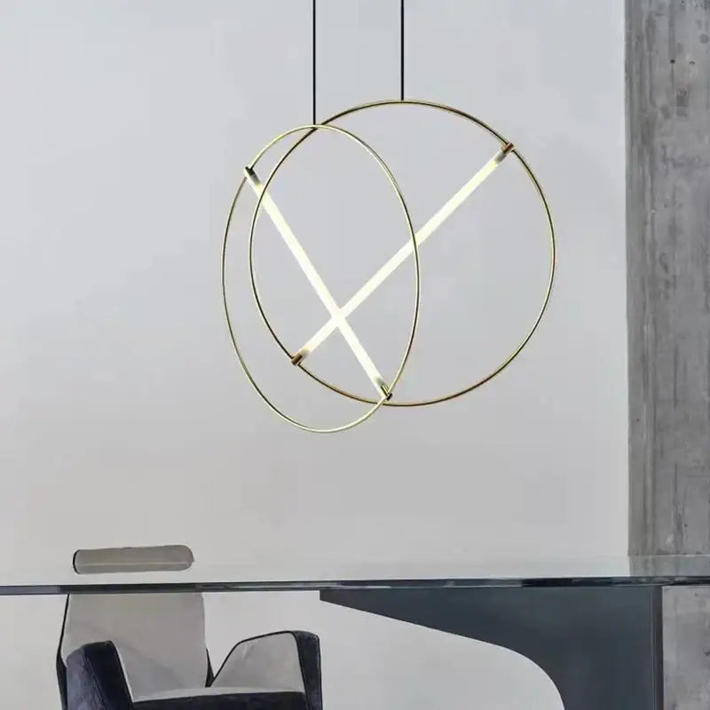 Modern gold-toned decorbites led metal pendant light with circular design and intersecting illuminated led strips for dining room and bedroom