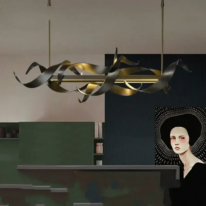 A decorbites led metal pendant light featuring flowing gold and dark bronze metallic ribbons in a modern sculptural design