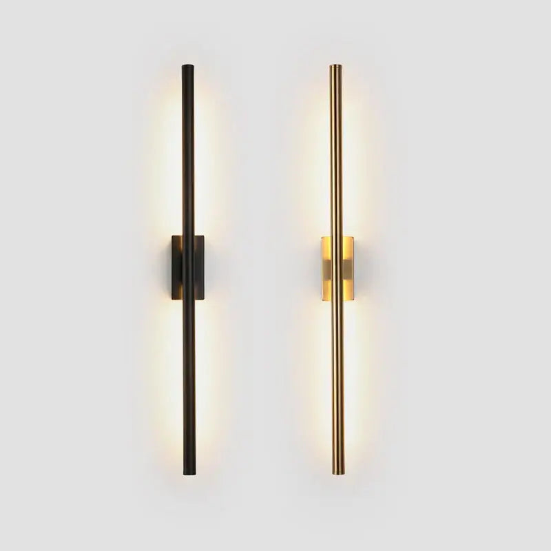 Two minimalist decorbites led metal tube wall lamps in matte black and brushed gold with integrated warm led lighting