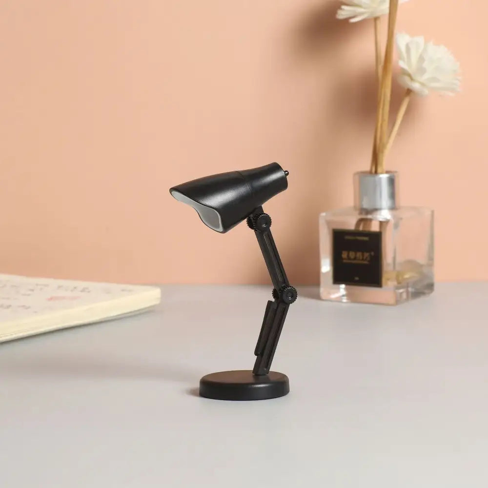 Black miniature decorbites led mini desk lamp with articulated arm, matte finish, clip, and magnetic base for study