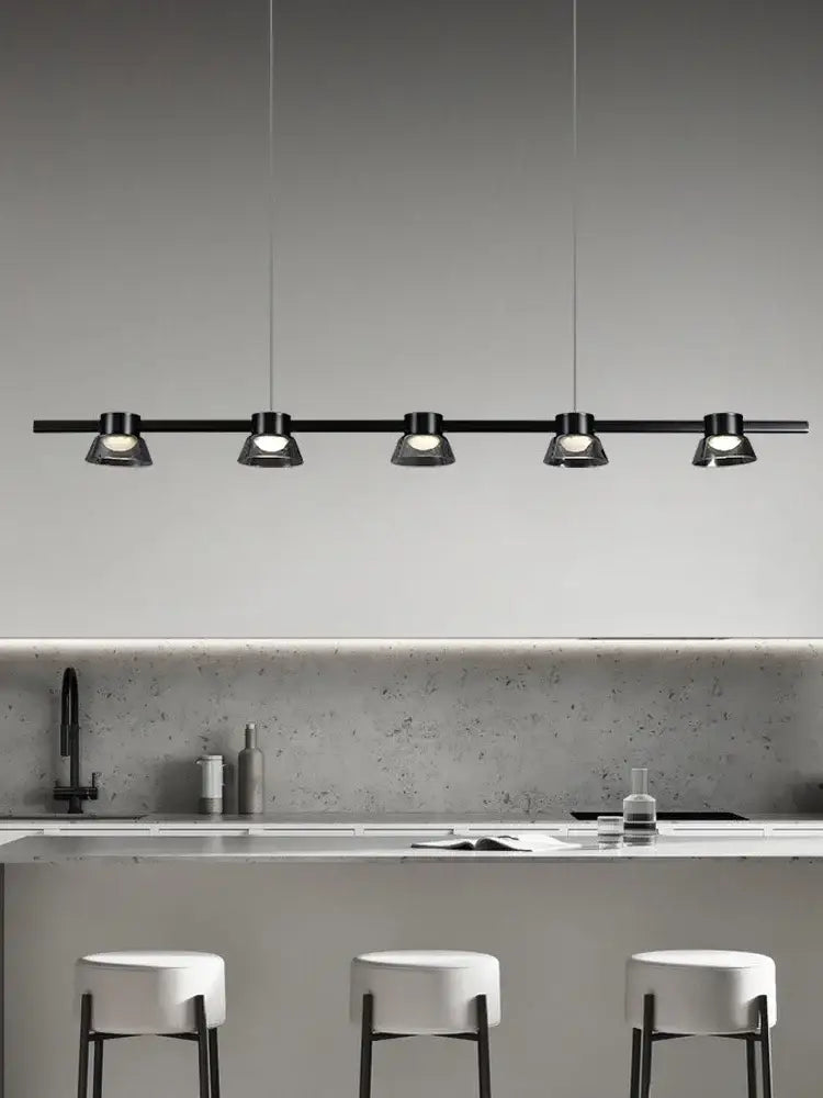 Black linear DecorBites LED minimalist pendant lights with five sleek spotlights for kitchen island decor