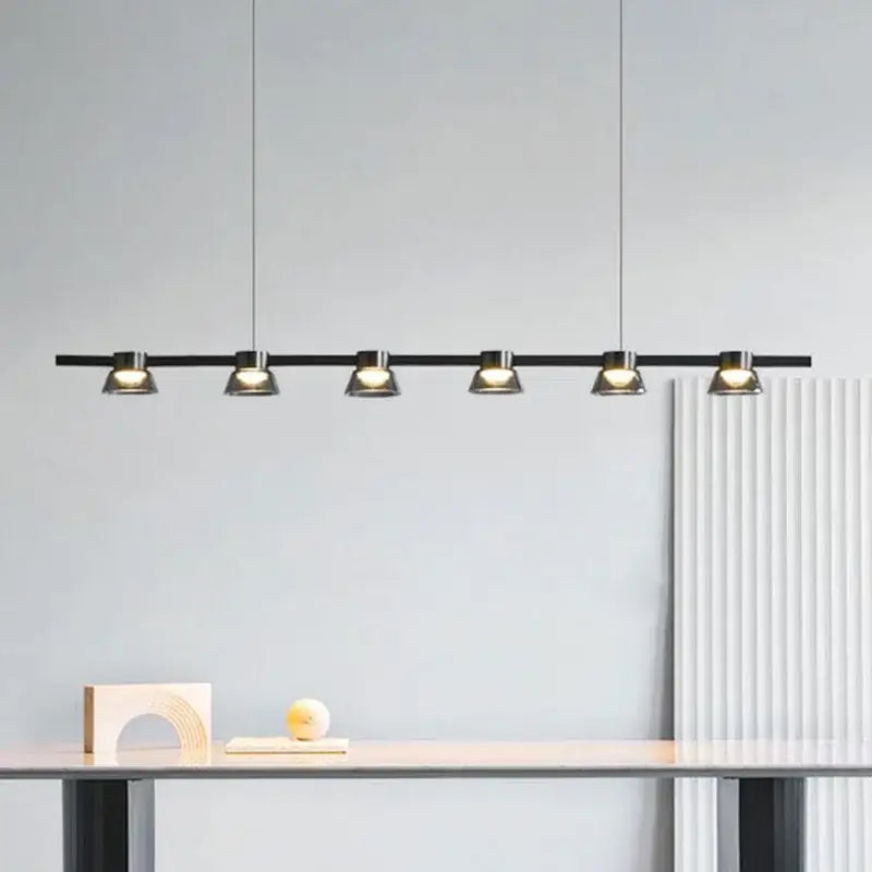 Modern black linear pendant lights with five warm spotlight fixtures for kitchen island by DecorBites led minimalist