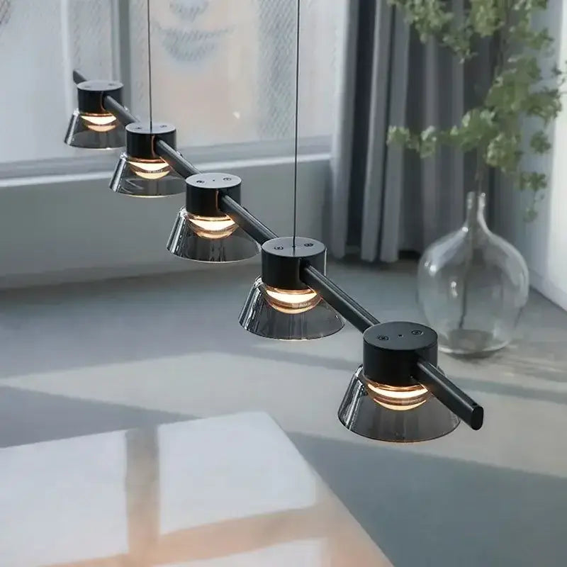 Modern black and chrome DecorBites LED minimalist pendant lights with five conical heads for kitchen island lighting