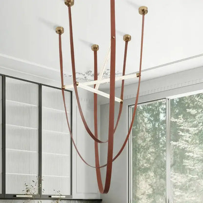 Decorbites led minimalist pendant lamp with slender brown leather straps brass fixtures and intersecting white light bars