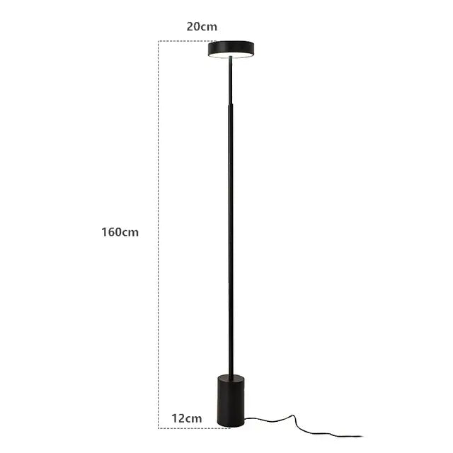 Black cylindrical DecorBites LED minimalist floor lamp with a circular light fixture for living room and bedroom decor