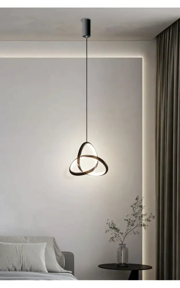 Modern black metal pendant light with interlocking ring design decorbites led minimalist pendant for bedroom and living room