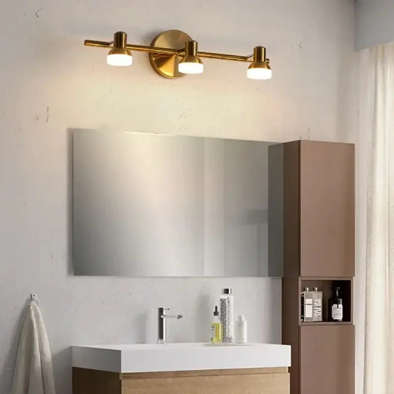 Brass-finished three-light wall lamp with frosted glass shades decorbites led mirror headlight for bathroom home decor