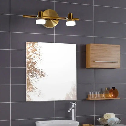 Gold-toned decorbites led mirror wall lamp with two cylindrical bulbs and circular base for bathroom or bedroom use