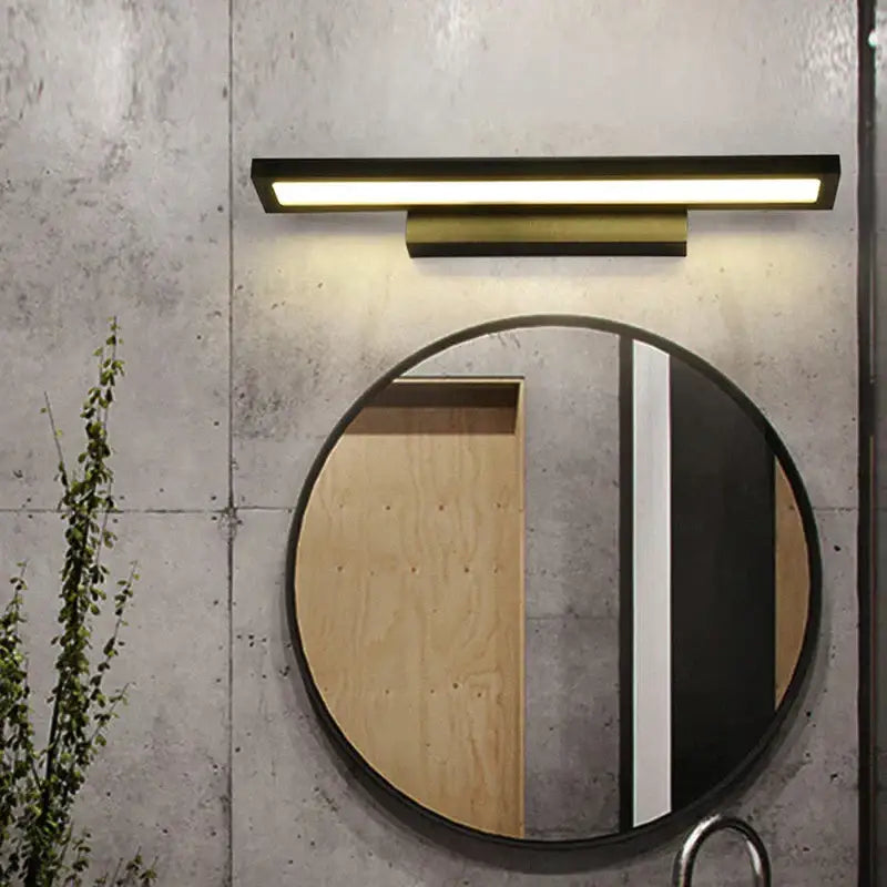 Modern black rectangular decorbites led mirror wall lamp with warm glow mounted above round bathroom mirror