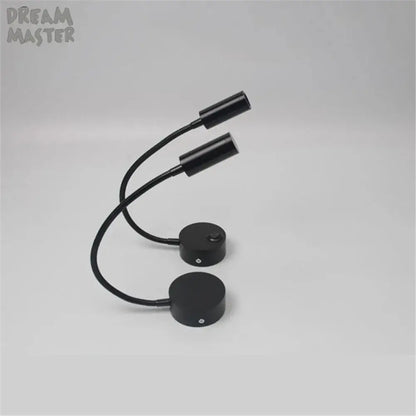 Black dual-head flexible desk lamp with curved gooseneck arms and circular base for decorbites led mirror bedside use