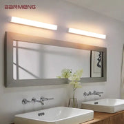 Two sleek modern warm white decorbites led mirror wall sconces mounted above a bathroom mirror for indoor lighting