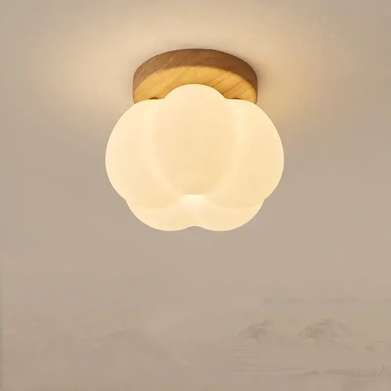 DecorBites led modern ceiling light with warm cloud shape frosted glass diffuser and natural wood base for living room