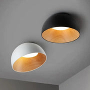 Two decorbites led modern semi-flush ceiling lamps in black and white with warm wood-toned interiors for indoor use