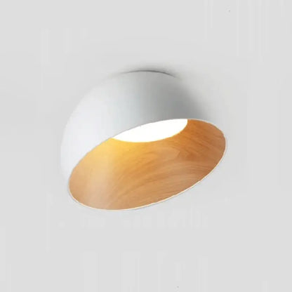 A decorbites led modern recessed ceiling lamp with white exterior and warm wood-toned interior for living spaces
