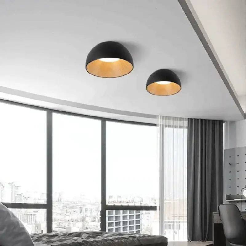 Black dome-shaped DecorBites™ led modern ceiling lamp with warm gold interior finish for bedroom and living room use