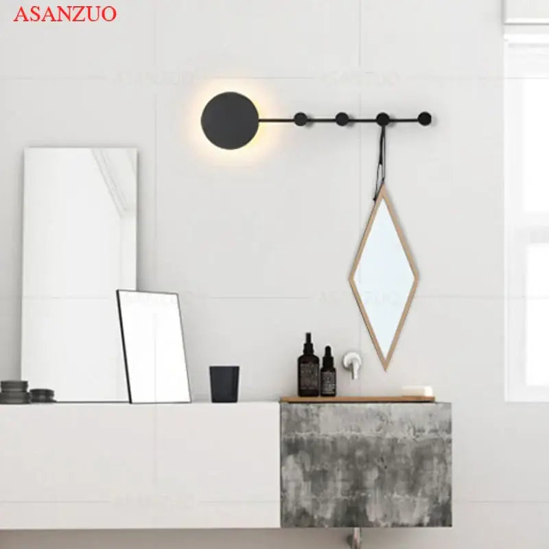 Black circular wall lamp with minimalist design and warm light emission decorbites led moon wall lamp for home ambiance