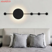 Black minimalist decorbites led moon wall lamp with circular lights on an elongated bar for home ambiance