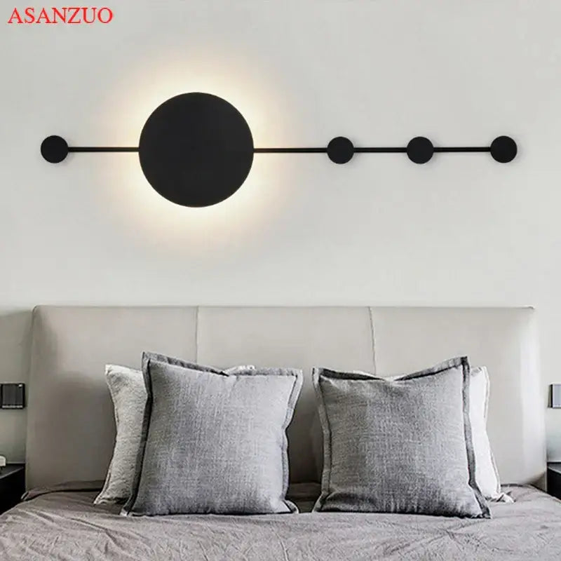 Black minimalist decorbites led moon wall lamp with circular lights on an elongated bar for home ambiance