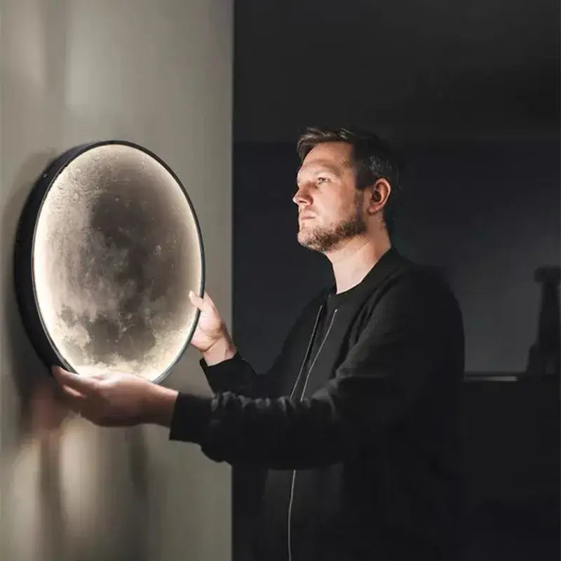 Circular wall lamp with textured moon-like surface and black frame from DecorBites led moon for modern room decor