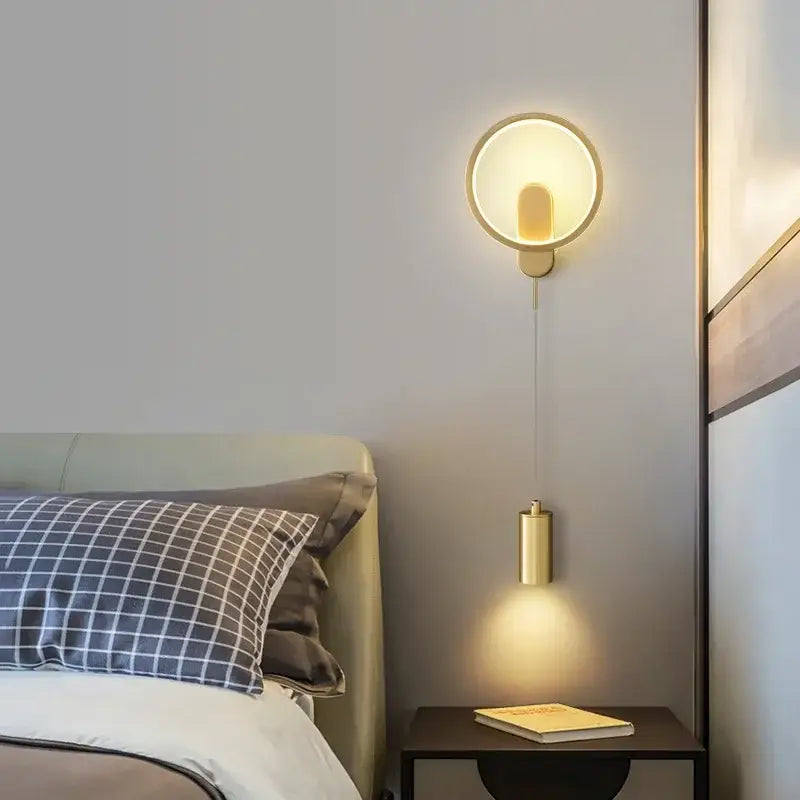 Gold-toned copper wall lamp decorbites led moon wall light with cylindrical pendant emitting warm ambient light