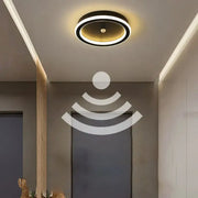 Modern circular ceiling light with black outer ring and warm white glow featuring decorbites led motion sensor