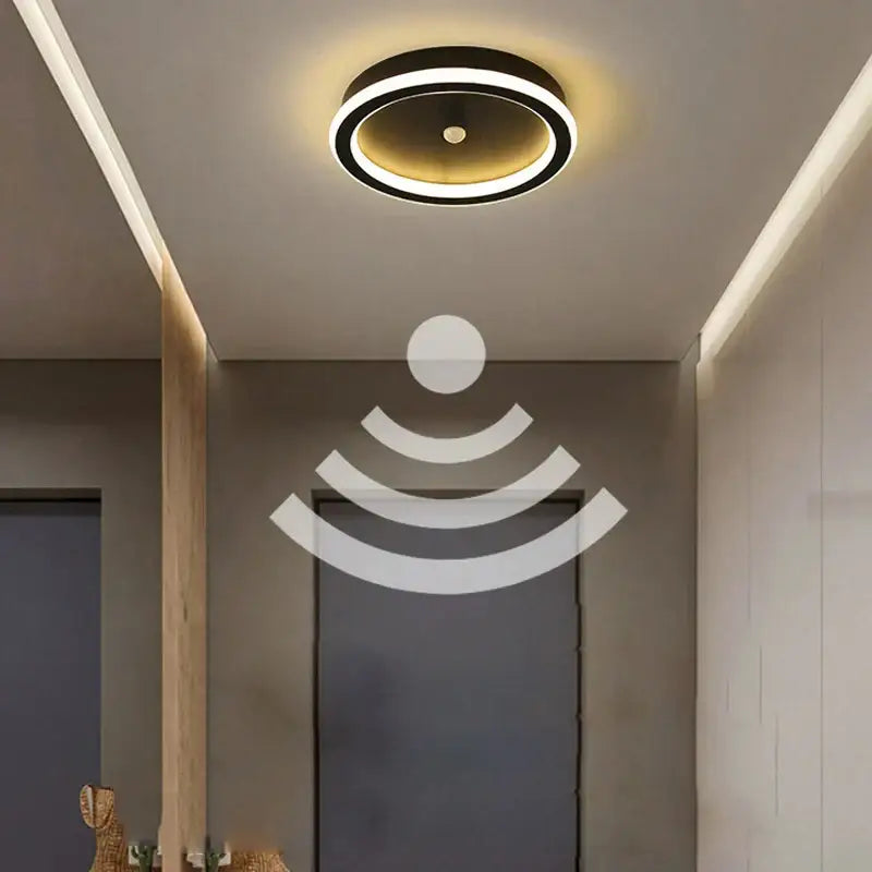 Modern circular ceiling light with black outer ring and warm white glow featuring decorbites led motion sensor