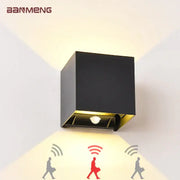 Black and gold DecorBites LED motion sensor wall lamp with cube shape and modern design for indoor outdoor use