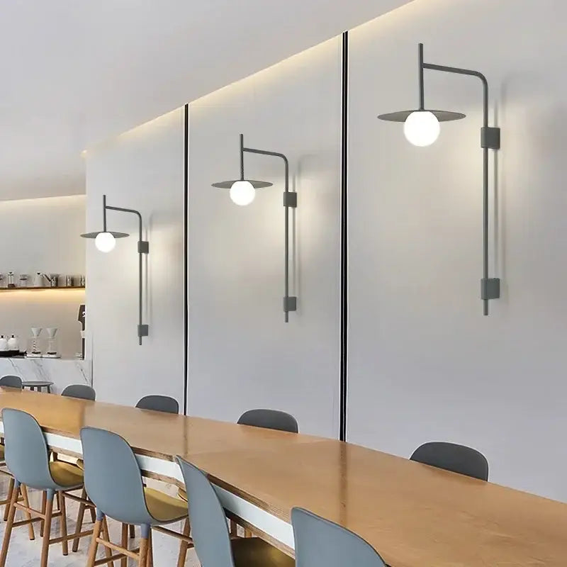 Modern black metal wall lamp with spherical white glass shades decorbites led movable arm for indoor bedroom lighting