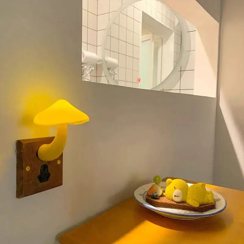 Yellow decorbites led mushroom night light with smooth glossy finish on wooden wall plate with light-controlled sensor