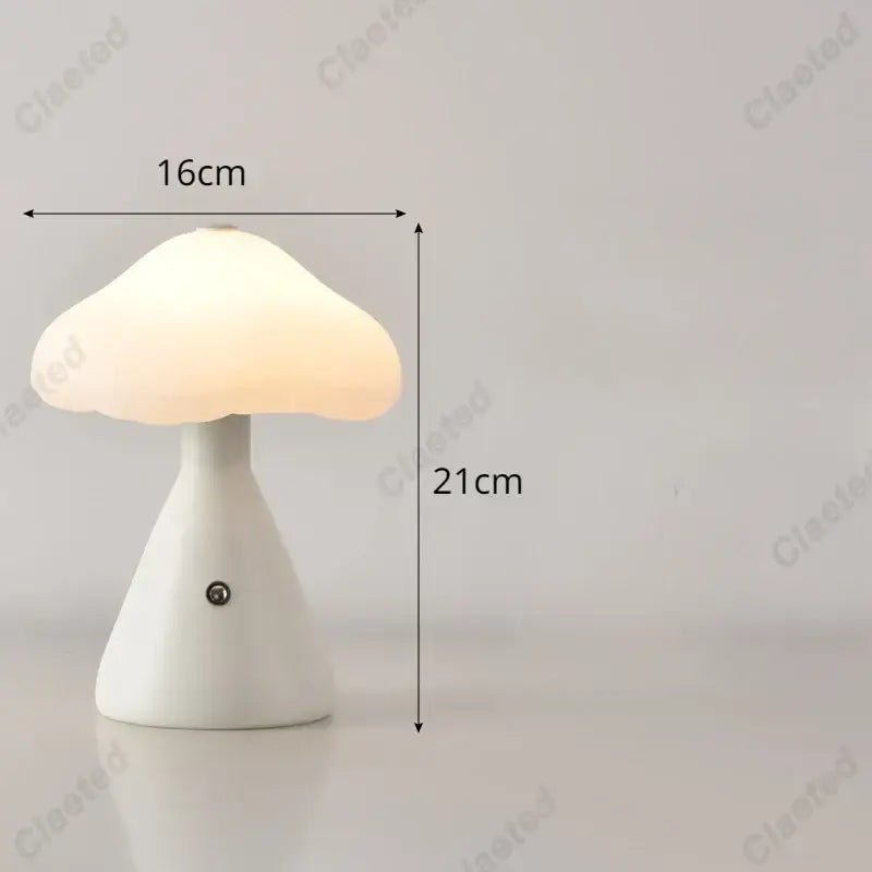 A sleek white DecorBites led mushroom night light with translucent cap and ceramic base for kid’s room decor