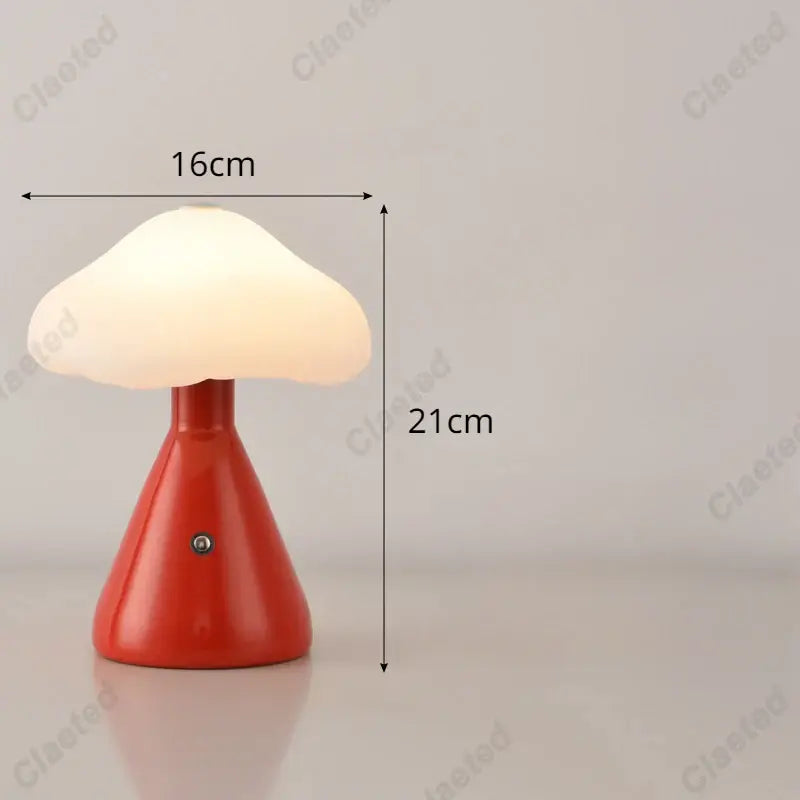 A sleek red decorbites led mushroom night light with a glossy finish and soft white illuminated cap for kids room decor