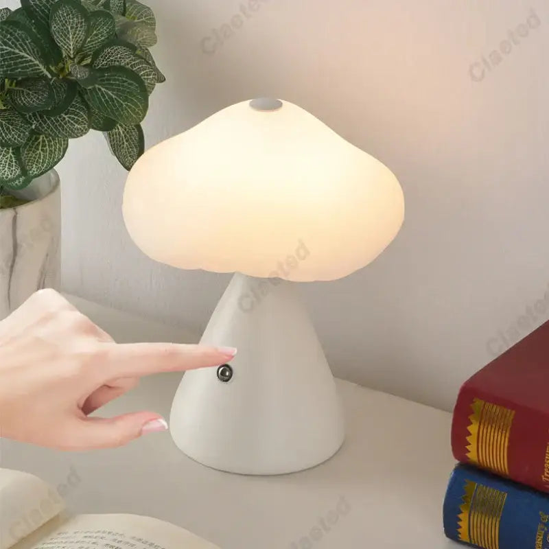 A soft white DecorBites led mushroom night light with smooth rounded cap and conical base for kid’s room decor