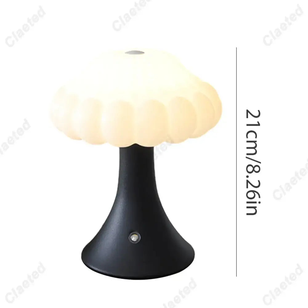 A sleek black decorbites led mushroom night light with a cream translucent dome for kid’s room decor