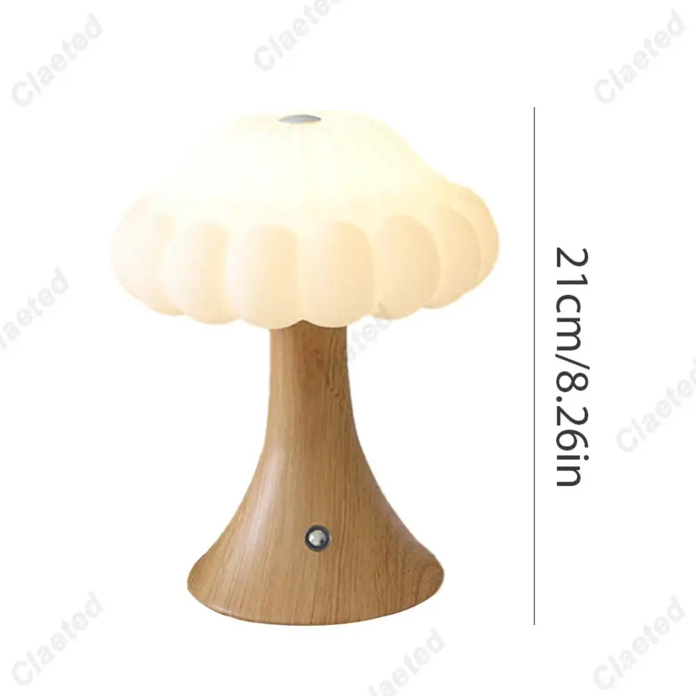 A soft cream-colored DecorBites LED mushroom night light with a wooden base and touch switch for kid’s room decor