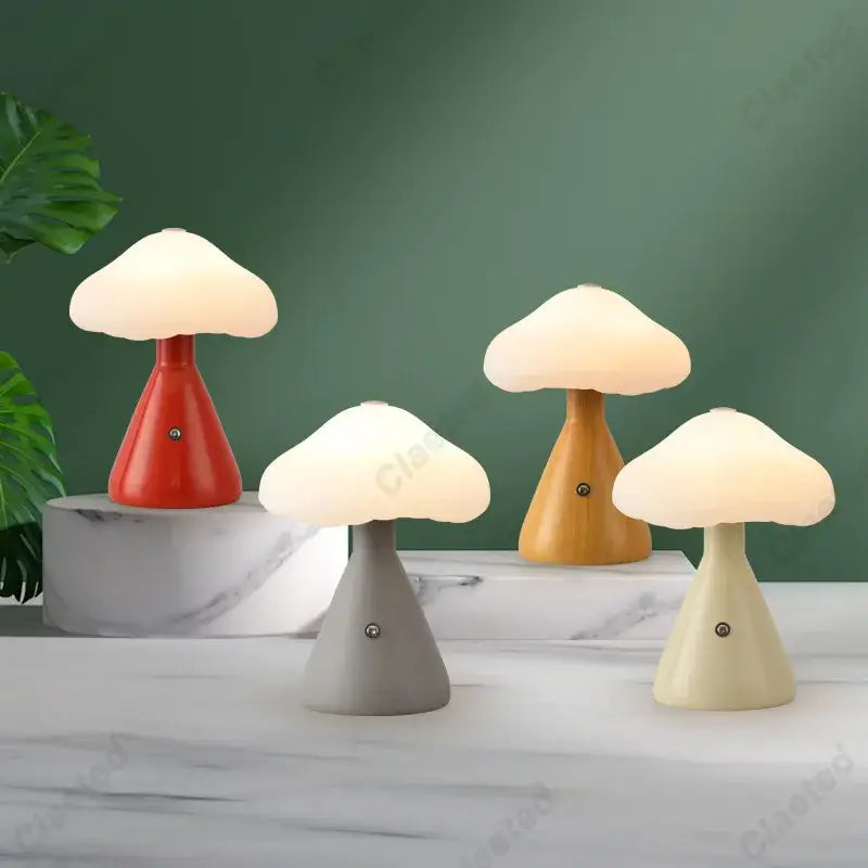 Four decorbites led mushroom night lights in red beige gray and wood tones with soft glowing white caps for bedside decor