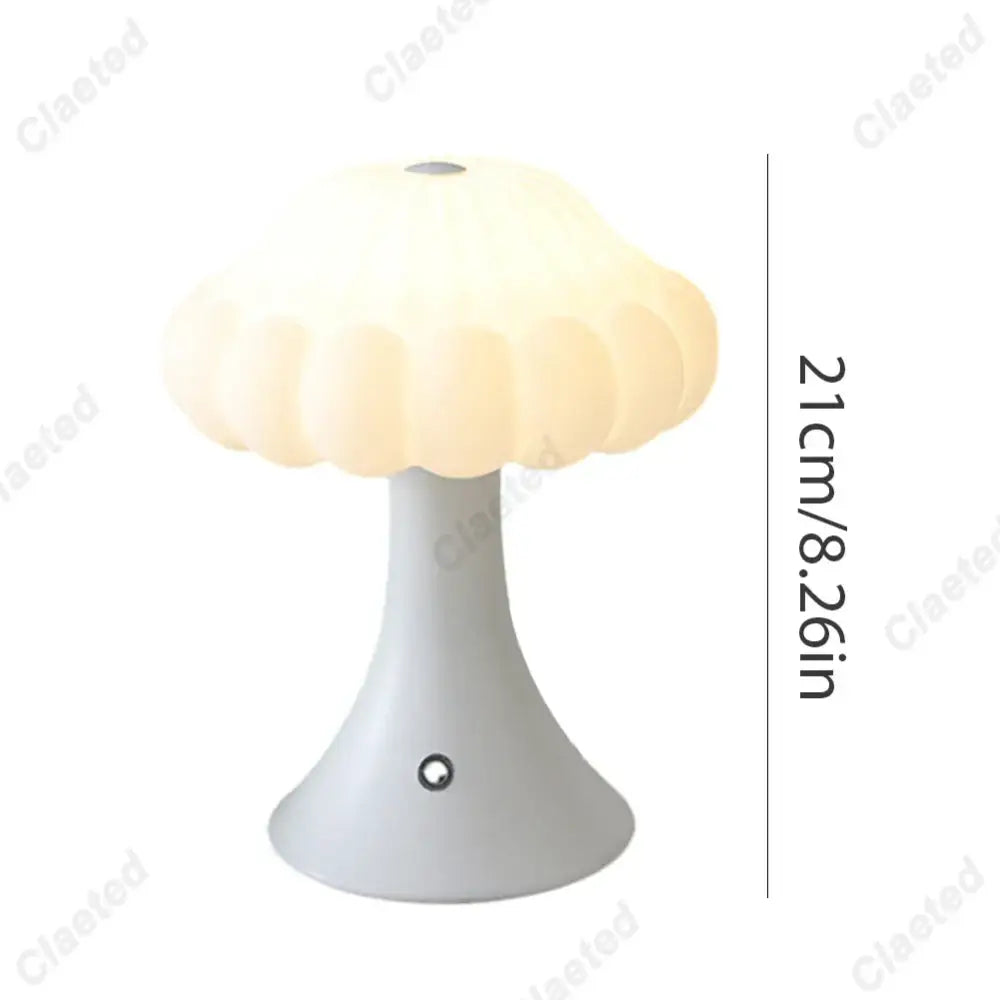 A cream-colored decorbites led mushroom night light with a smooth matte base and translucent petal-like shade for kids room decor