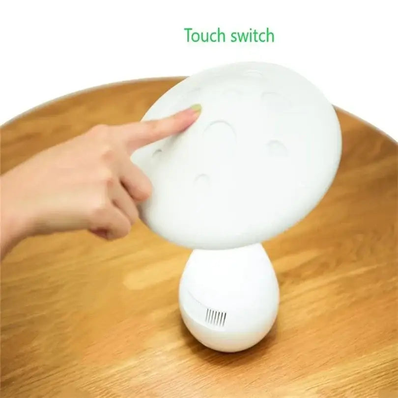 White decorbites led mushroom table lamp with smooth glossy plastic finish and subtle circular indentations on cap